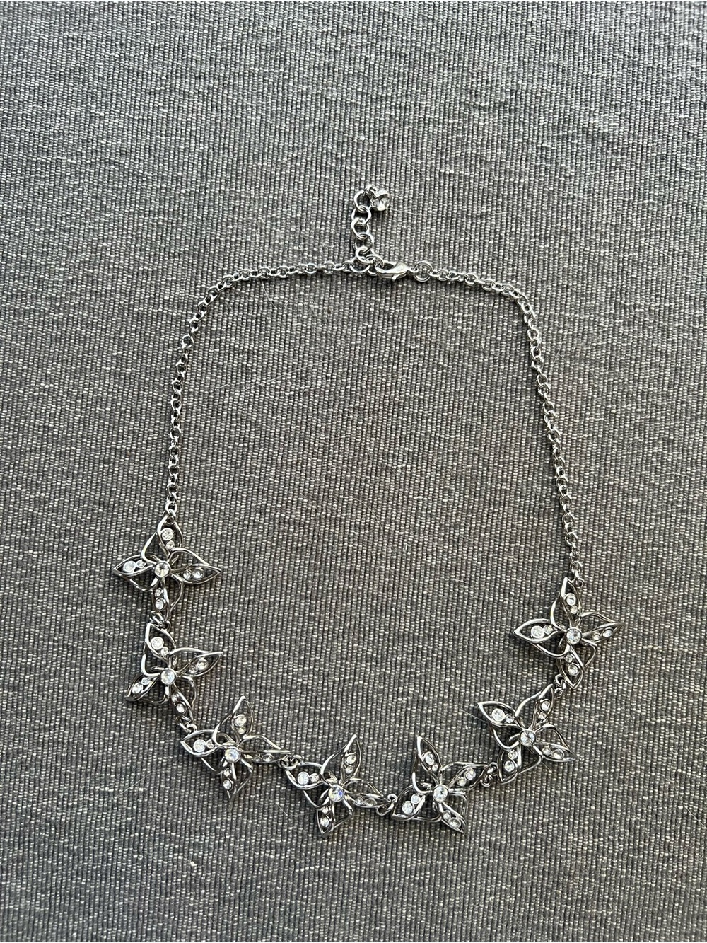 Silver tone summer-y necklace.